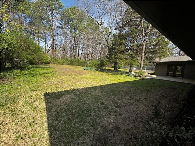 view of yard featuring french doors
