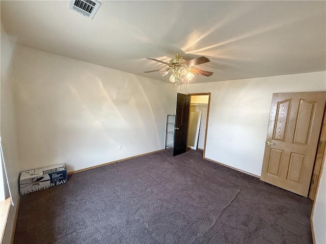 5 Arrowhead Ln, Clarksville, AR 72830 - unfurnished room with dark carpet, a ceiling fan, and baseboards