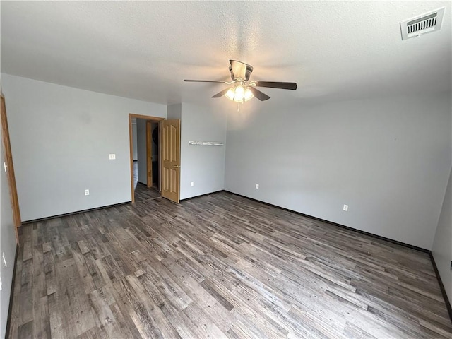 5 Arrowhead Ln, Clarksville, AR 72830 - spare room featuring a ceiling fan, wood finished floors, baseboards, and a textured ceiling