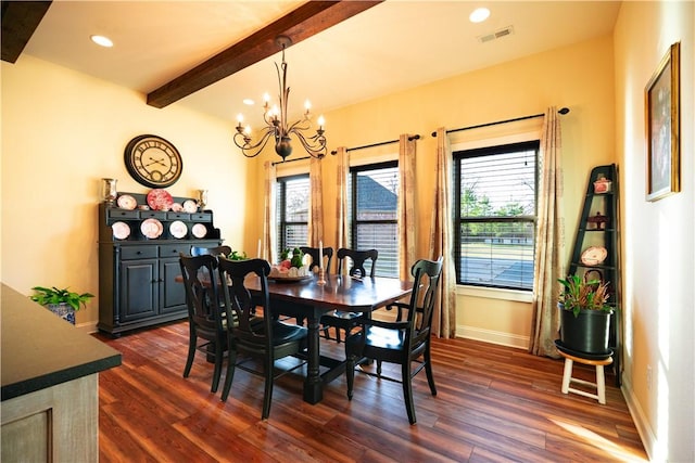 dining room featuring dark wood finished floors, a chandelier, and a healthy amount of sunlight