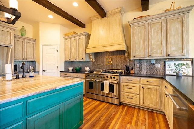kitchen featuring beam ceiling, stainless steel appliances, dark wood-type flooring, tasteful backsplash, and custom exhaust hood