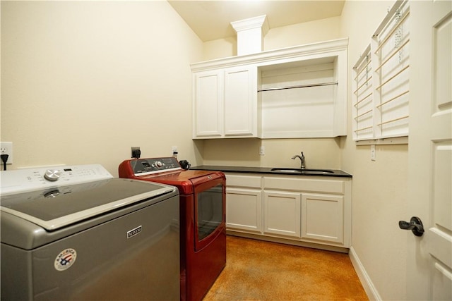 washroom featuring independent washer and dryer, baseboards, a sink, light carpet, and cabinet space