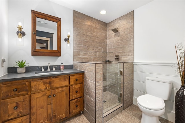 617 N Fallin Ave, Fayetteville, AR 72701 - bathroom with toilet, vanity, and a stall shower
