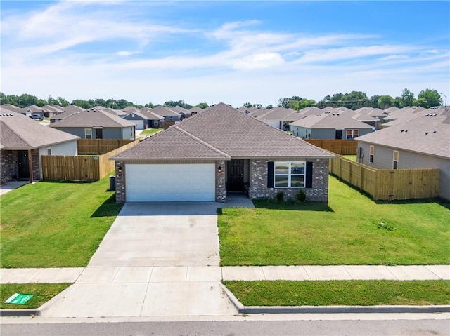 1405 Corsac St, Siloam Springs, AR 72761 - view of front of home featuring a residential view, an attached garage, driveway, and brick siding