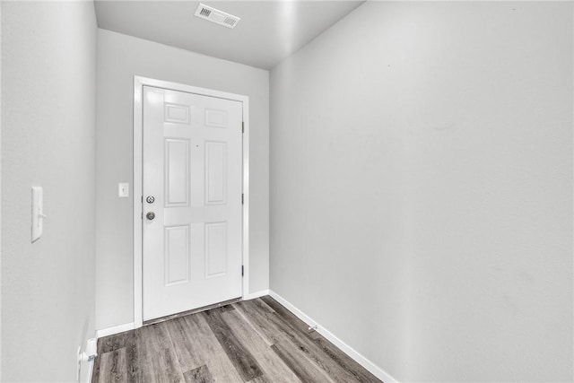 1405 Corsac St, Siloam Springs, AR 72761 - doorway with wood finished floors and baseboards