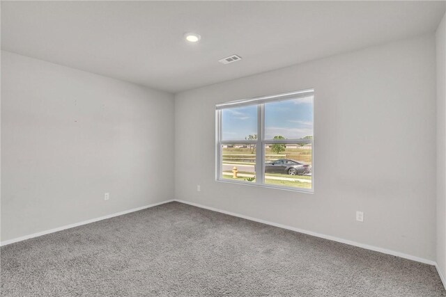 1405 Corsac St, Siloam Springs, AR 72761 - spare room featuring carpet floors, baseboards, and recessed lighting