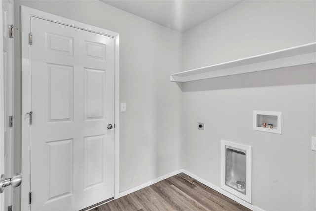 1405 Corsac St, Siloam Springs, AR 72761 - washroom featuring hookup for a washing machine, electric dryer hookup, wood finished floors, and baseboards