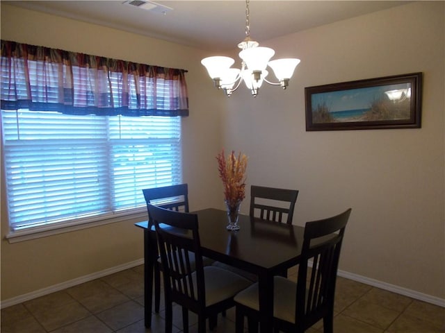 6527 Huntington Ct, Fort Smith, AR 72916 - dining area featuring an inviting chandelier, tile patterned flooring, baseboards, and visible vents