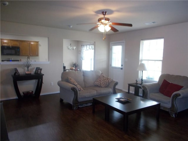 6527 Huntington Ct, Fort Smith, AR 72916 - living area with ceiling fan, visible vents, and wood finished floors