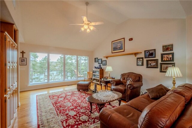 44 Devizis Dr, Bella Vista, AR 72714 - living room featuring light wood-style flooring, a ceiling fan, and high vaulted ceiling