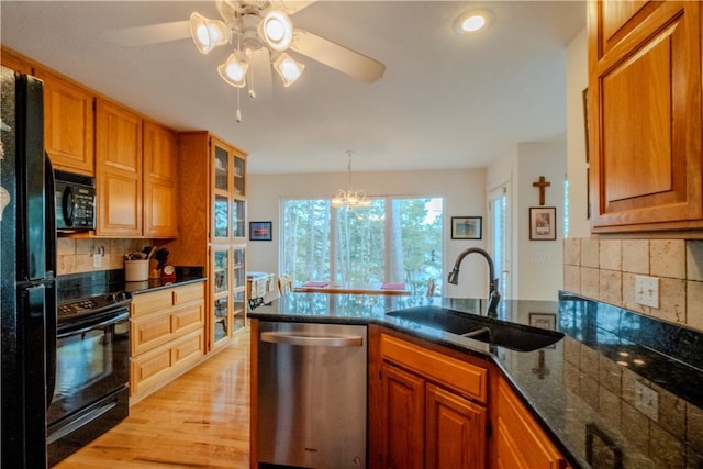 44 Devizis Dr, Bella Vista, AR 72714 - kitchen featuring black appliances, a sink, decorative backsplash, ceiling fan, and brown cabinets