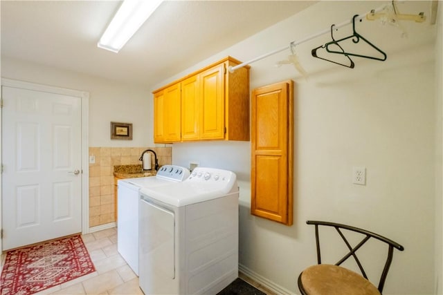44 Devizis Dr, Bella Vista, AR 72714 - laundry room featuring cabinet space, washing machine and dryer, light tile patterned floors, and tile walls