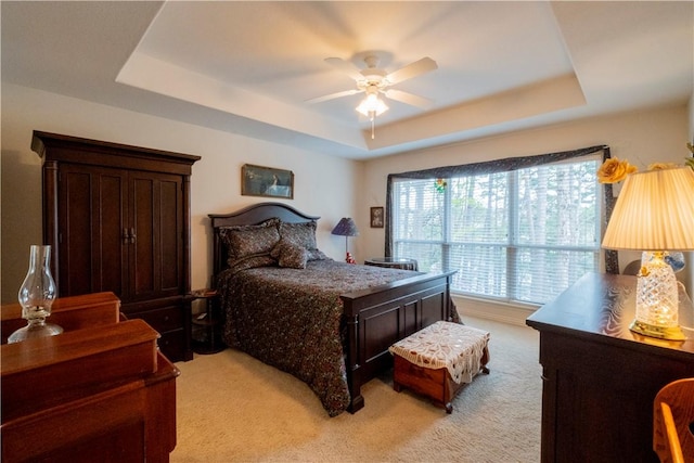 44 Devizis Dr, Bella Vista, AR 72714 - bedroom with a raised ceiling, light carpet, and a ceiling fan