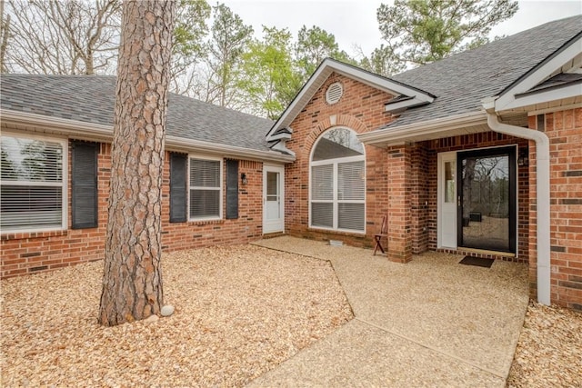 44 Devizis Dr, Bella Vista, AR 72714 - entrance to property featuring a shingled roof and brick siding