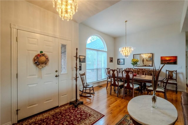 44 Devizis Dr, Bella Vista, AR 72714 - entryway with a chandelier and light wood-type flooring