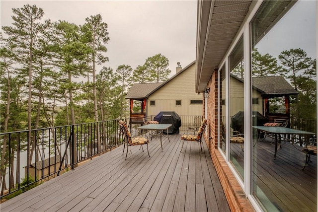 44 Devizis Dr, Bella Vista, AR 72714 - wooden terrace with area for grilling