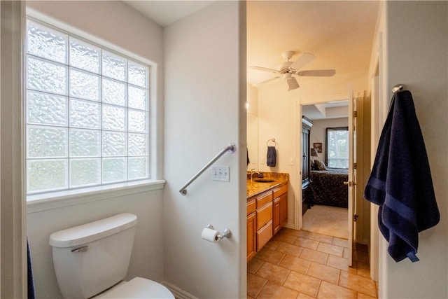 44 Devizis Dr, Bella Vista, AR 72714 - ensuite bathroom featuring healthy amount of natural light, toilet, ceiling fan, and vanity