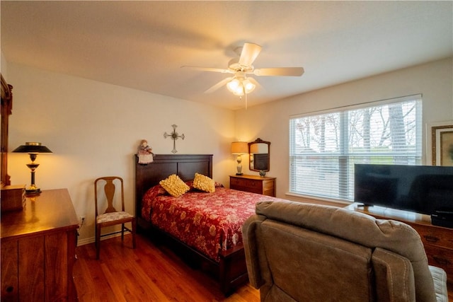 44 Devizis Dr, Bella Vista, AR 72714 - bedroom featuring wood finished floors, baseboards, and a ceiling fan