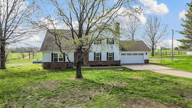 188 Lonestar Rd, Anderson, MO 64831 - view of front facade featuring brick siding, concrete driveway, an attached garage, and board and batten siding
