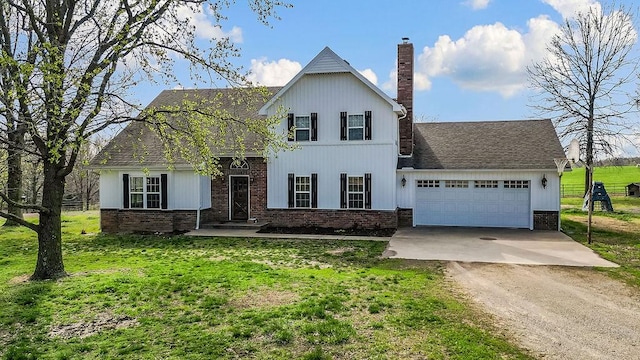 188 Lonestar Rd, Anderson, MO 64831 - view of front of house with dirt driveway, brick siding, an attached garage, and a front lawn