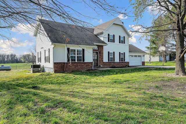 188 Lonestar Rd, Anderson, MO 64831 - view of front facade with driveway, a garage, central air condition unit, a shingled roof, and brick siding