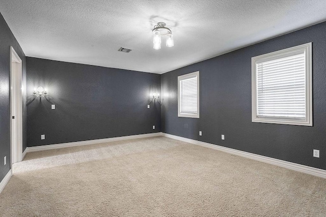 188 Lonestar Rd, Anderson, MO 64831 - carpeted spare room featuring a textured ceiling and baseboards