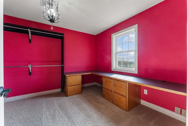 188 Lonestar Rd, Anderson, MO 64831 - unfurnished office featuring built in desk, carpet, and baseboards