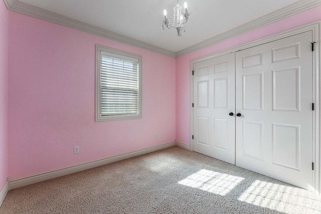 188 Lonestar Rd, Anderson, MO 64831 - unfurnished bedroom featuring light carpet, a chandelier, baseboards, ornamental molding, and a closet