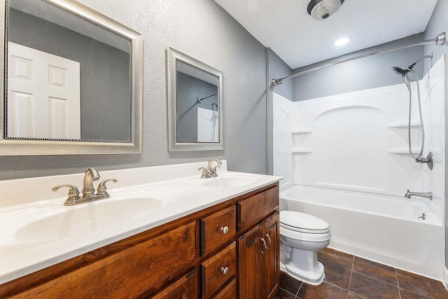 188 Lonestar Rd, Anderson, MO 64831 - bathroom featuring shower / washtub combination, double vanity, toilet, and a textured wall
