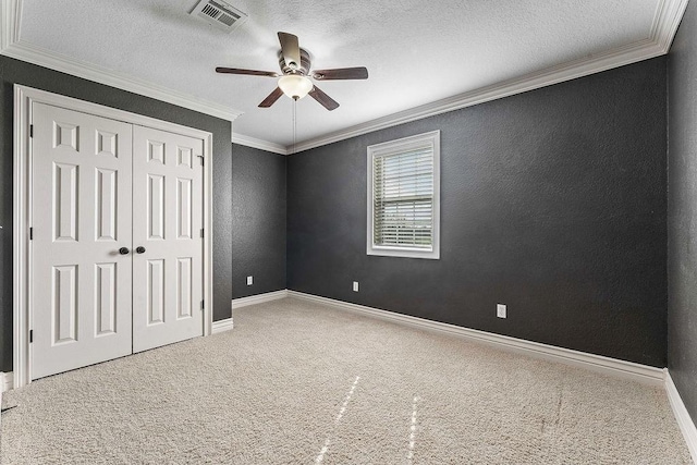 188 Lonestar Rd, Anderson, MO 64831 - unfurnished bedroom featuring carpet floors, a closet, ornamental molding, a textured ceiling, and baseboards