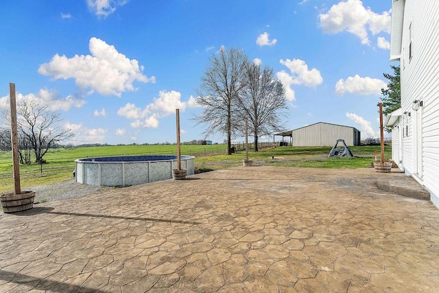 188 Lonestar Rd, Anderson, MO 64831 - view of patio / terrace featuring an outdoor pool, an outbuilding, and a pole building