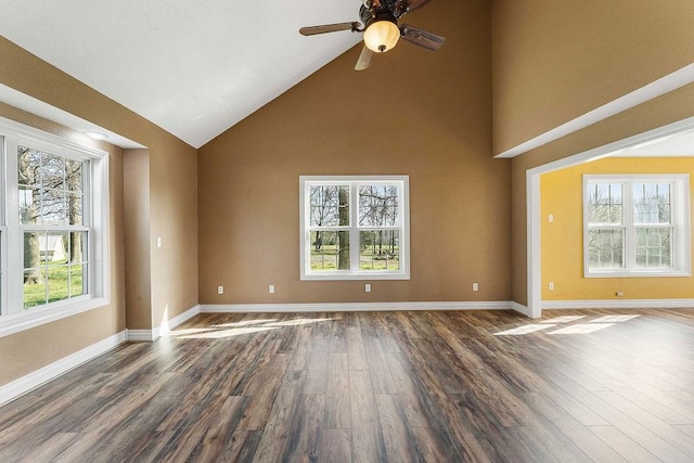 188 Lonestar Rd, Anderson, MO 64831 - empty room featuring dark wood-type flooring, high vaulted ceiling, a ceiling fan, and baseboards