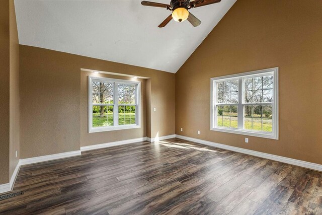 188 Lonestar Rd, Anderson, MO 64831 - spare room featuring a ceiling fan, dark wood finished floors, high vaulted ceiling, and baseboards