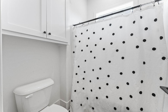 bathroom featuring toilet
