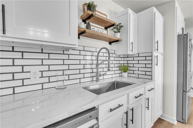 17225 Featherstone Trl, Gentry, AR 72734 - kitchen featuring white cabinetry, a sink, open shelves, and freestanding refrigerator