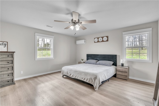 17225 Featherstone Trl, Gentry, AR 72734 - bedroom with multiple windows, visible vents, a wall unit AC, and baseboards
