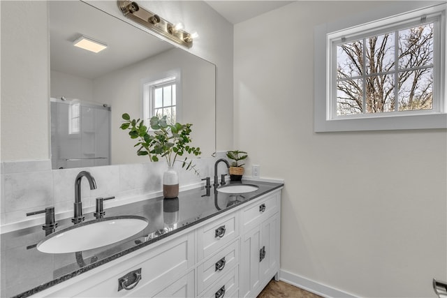 17225 Featherstone Trl, Gentry, AR 72734 - full bath featuring baseboards, double vanity, a sink, and a shower stall