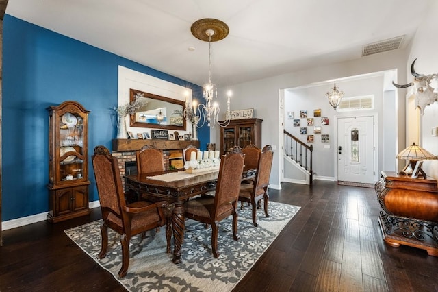 6628 Bernice Ave, Springdale, AR 72762 - dining area featuring a chandelier, stairs, baseboards, and hardwood / wood-style flooring