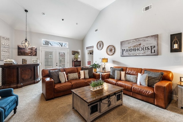 6628 Bernice Ave, Springdale, AR 72762 - living room with carpet floors, high vaulted ceiling, and french doors