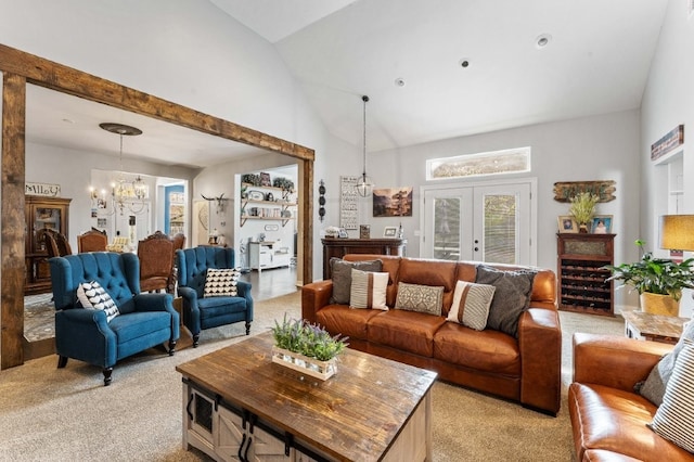 6628 Bernice Ave, Springdale, AR 72762 - living room featuring light colored carpet, vaulted ceiling, a chandelier, and french doors