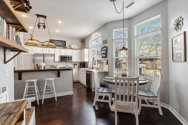 6628 Bernice Ave, Springdale, AR 72762 - dining area featuring dark wood finished floors, recessed lighting, and baseboards