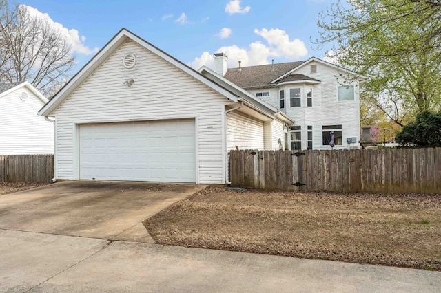 6628 Bernice Ave, Springdale, AR 72762 - view of front of home with concrete driveway, a chimney, and a garage