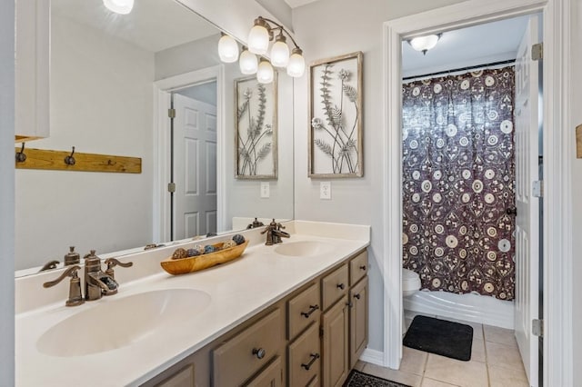 6628 Bernice Ave, Springdale, AR 72762 - bathroom featuring double vanity, tile patterned floors, and toilet