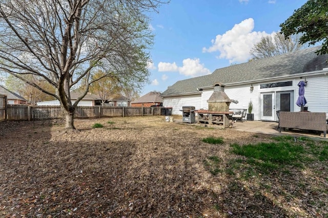 6628 Bernice Ave, Springdale, AR 72762 - fenced backyard featuring a patio area and french doors