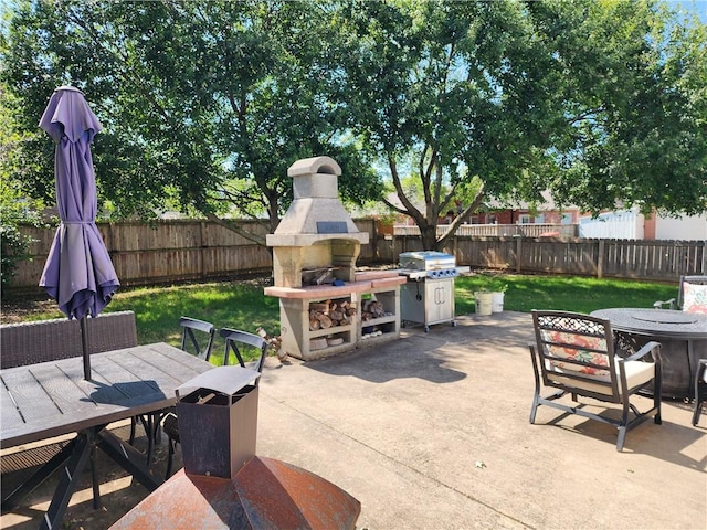 6628 Bernice Ave, Springdale, AR 72762 - view of patio / terrace featuring an outdoor fireplace, outdoor dining area, and grilling area