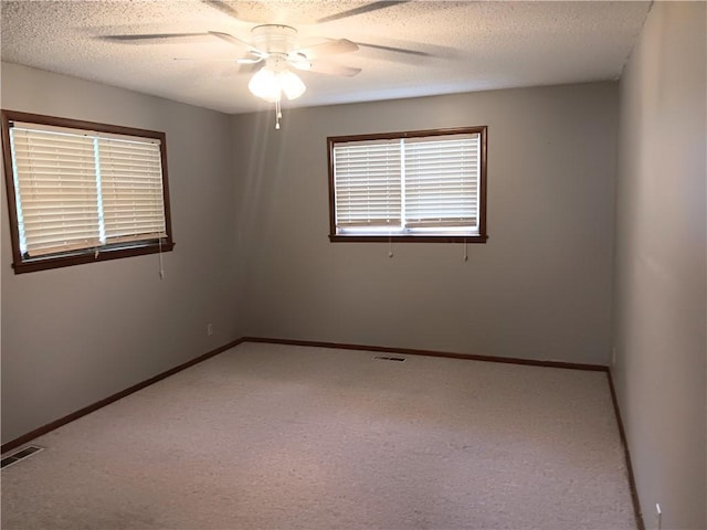 1003 Freeman Ave, Berryville, AR 72616 - carpeted spare room featuring a ceiling fan, a textured ceiling, and baseboards