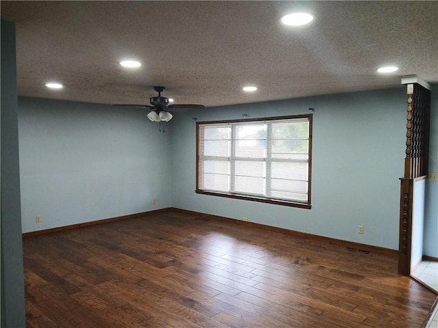 1003 Freeman Ave, Berryville, AR 72616 - spare room with a ceiling fan, recessed lighting, a textured ceiling, wood finished floors, and baseboards