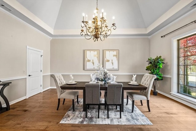 17793 Bluffview Dr, Springdale, AR 72764 - dining room featuring a chandelier, hardwood / wood-style flooring, and high vaulted ceiling