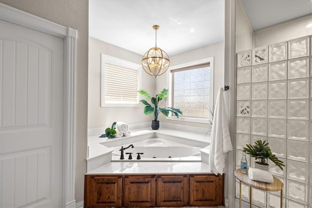 17793 Bluffview Dr, Springdale, AR 72764 - bathroom featuring a whirlpool tub and a chandelier