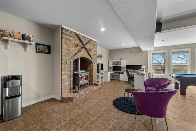 17793 Bluffview Dr, Springdale, AR 72764 - tiled living area with a wood stove, billiards, a textured ceiling, recessed lighting, and an office area